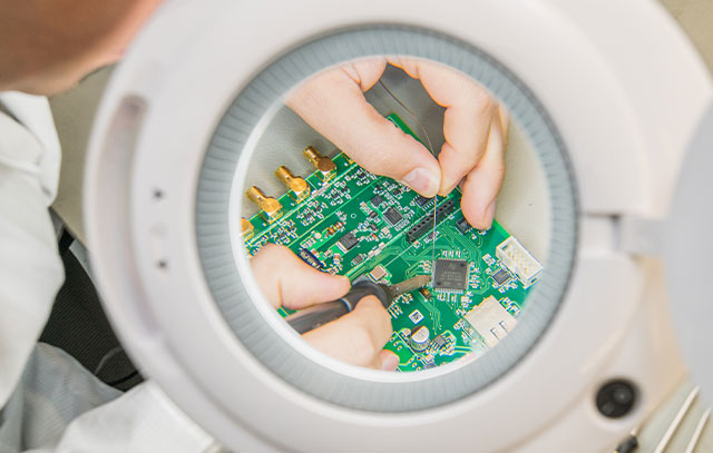 RFID development (A hand taps the touch field of a laptop with two fingers.)