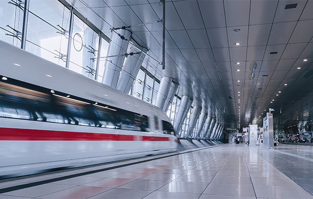 A modern station with an arriving train