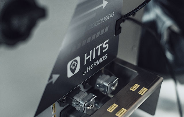 A part of a machine foiled with the HITS logo